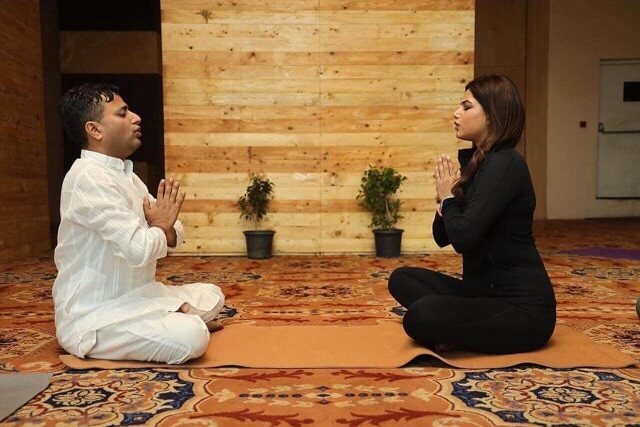 Dr Yogi Amrit Raj doing yoga with Miss Universe Harnaaz Kaur Sandhu